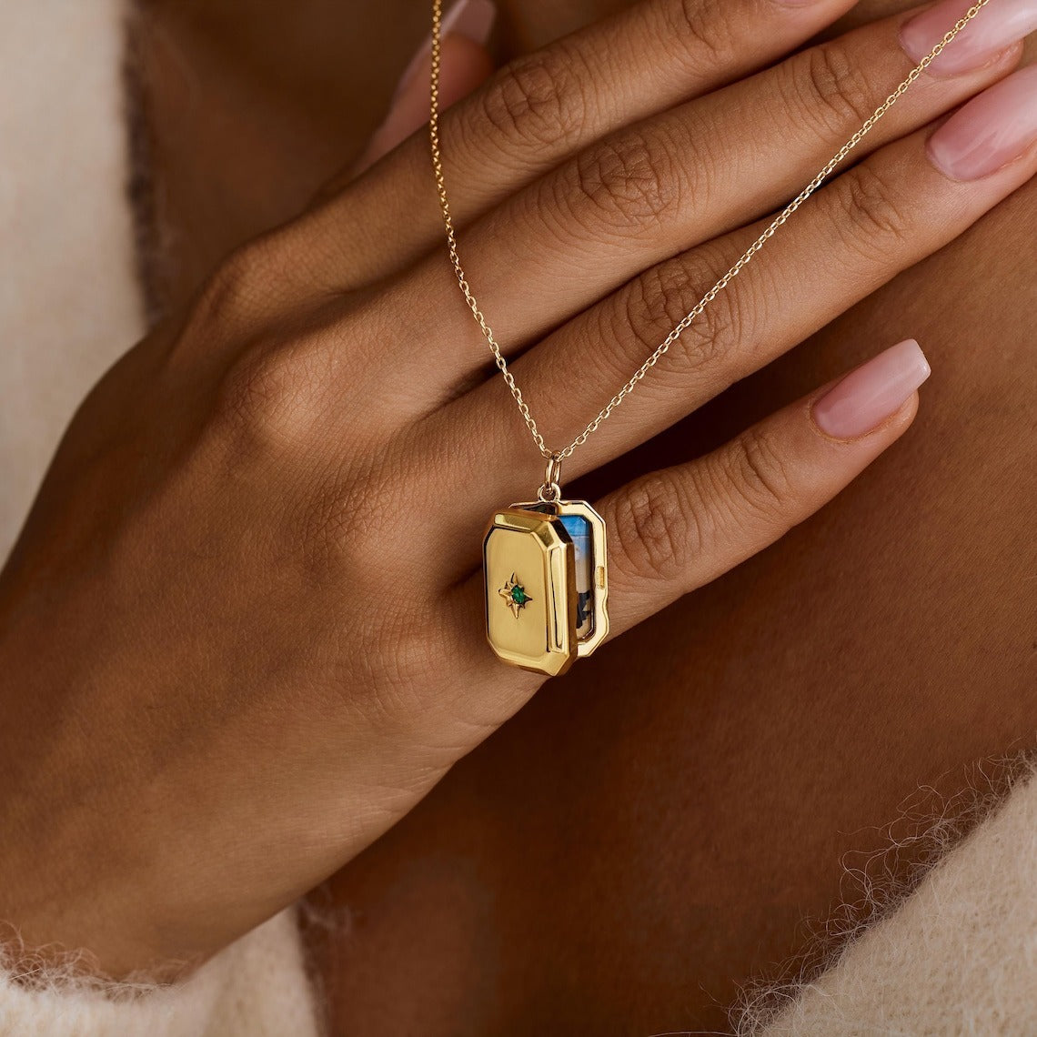 A Pendant Necklace With Birthstones Embedded In It