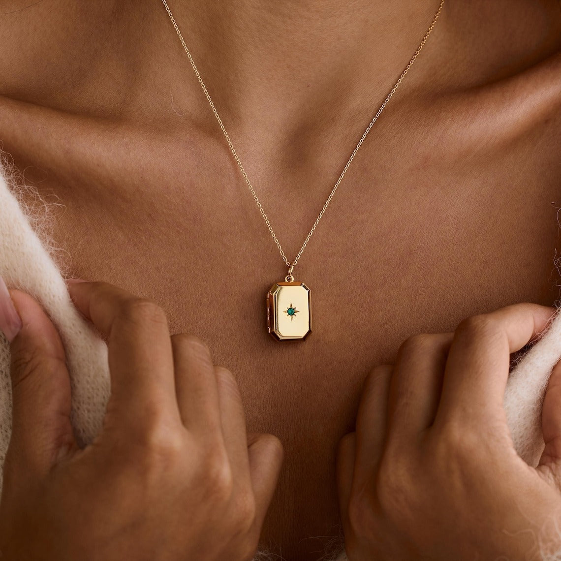 A Pendant Necklace With Birthstones Embedded In It